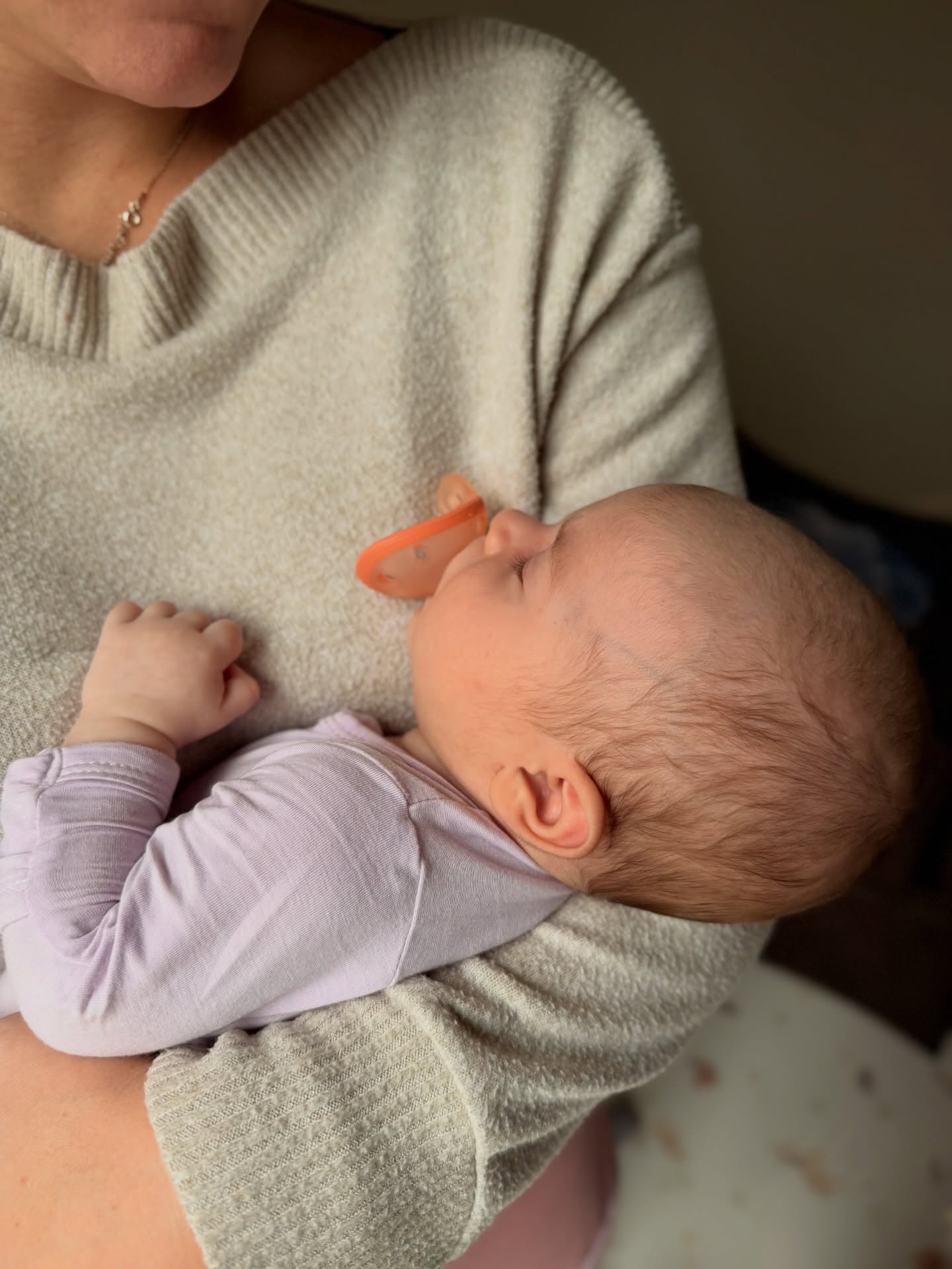 A mother soothing her newborn with Garkoko