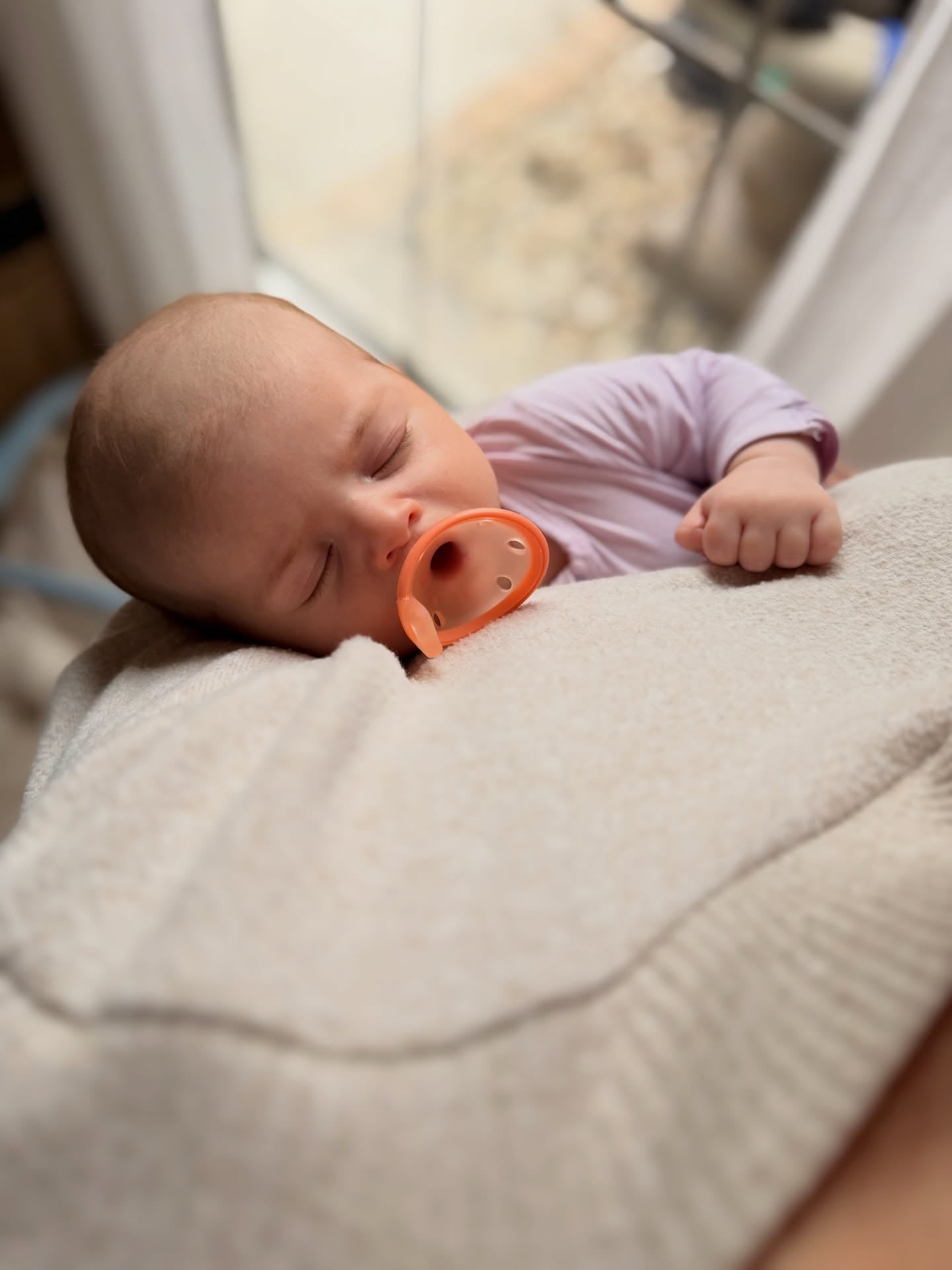 Sleeping newborn with Garkoko pacifier
